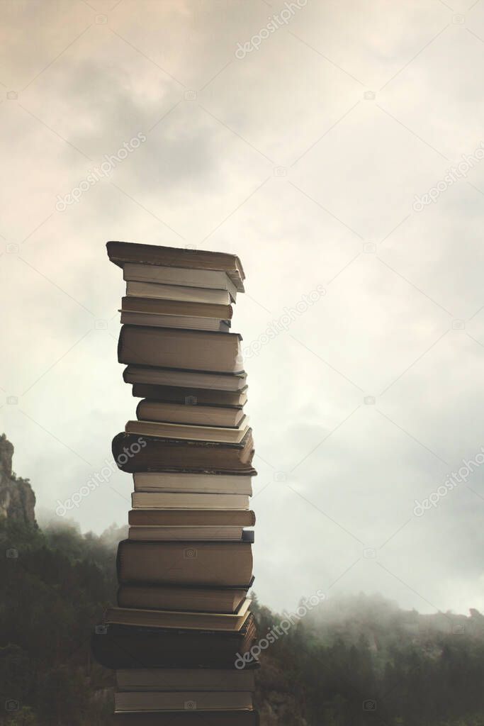 concept of power of knowledge, stack of books reaching up to the sky