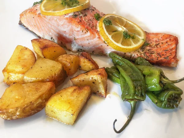 Grilled Salmon Steak with Prepared Potatoes and Peppers