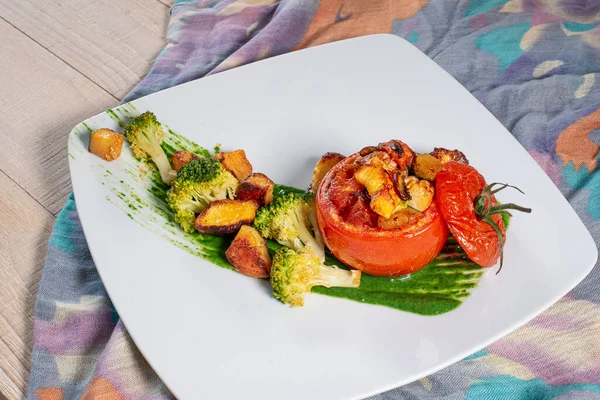 Tomatoes stuffed with vegetables and chicken