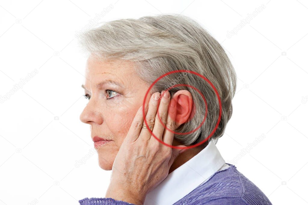 Mature woman with noise in the ear