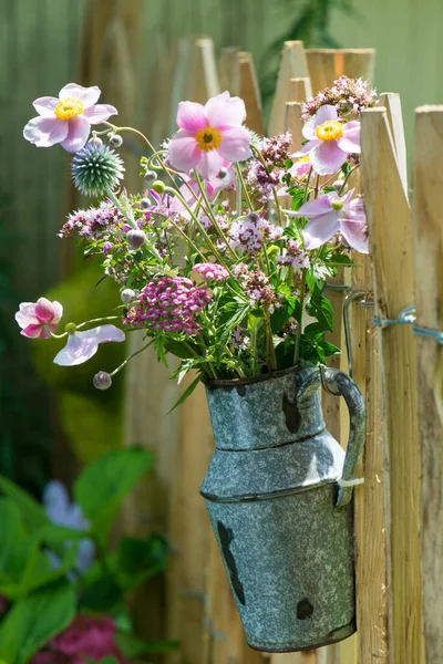 Summer flowers on a garden fence