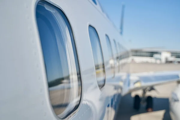 Glass windows on a passenger aircraft fuselage — Stock Photo, Image