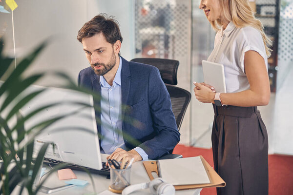 Business colleagues working together in modern office