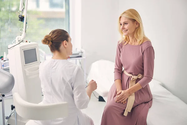 Charming blonde woman being glad of good results — Stock Photo, Image