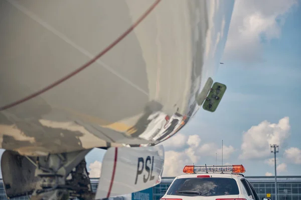 Airliner following the car after the landing — Stock Photo, Image