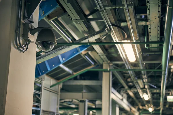 Security surveillance camera on a wall of a building — Stock Photo, Image