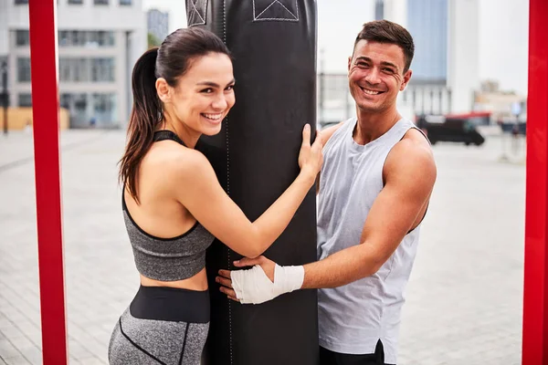 Happy young couple during boxing training outdoors — Stock Photo, Image