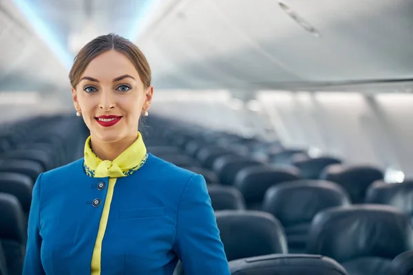 Beautiful charming stewardess dressed in official uniform — Stock Photo, Image