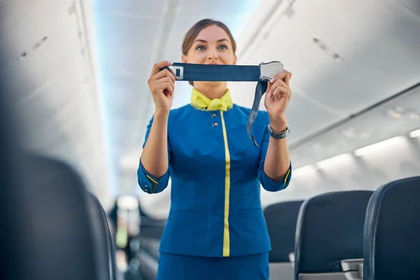 Charming air hostess training safety prior procedures to flight take off — Stock Photo, Image