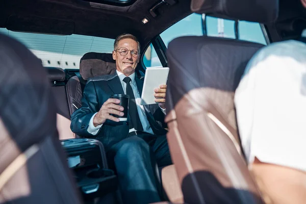 Happy businessman relaxing during transfer from airport — Stock Photo, Image