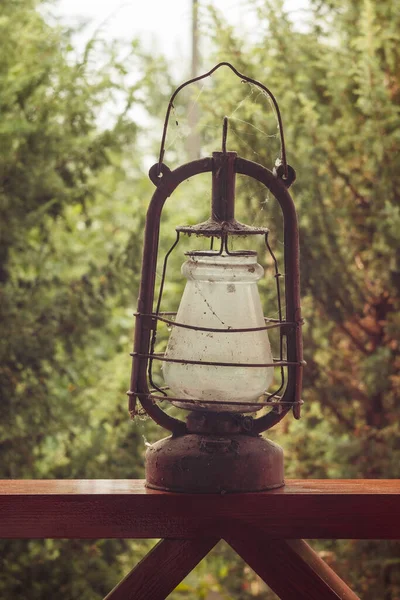 Old vintage gas lamp on green background