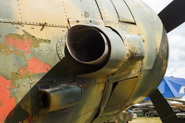 Details of the fuselage of an old aircraft. Old camouflage surface with exfoliated paint and rivets on a military aircraft.