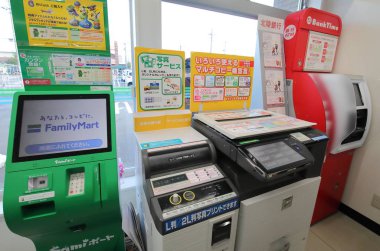 KANAZAWA JAPAN - AUGUST 04, 2018: Japanese convenience store services provided such as ATM, money transfer and photocopying services. clipart