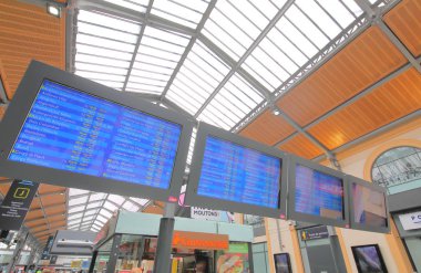 PARIS FRANCE - MAY 24, 2019: Train timetable display at Saint Lazare train station Paris France clipart