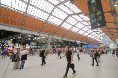 PARIS FRANCE - MAY 24, 2019: Unidentified people travel at Saint Lazare train station Paris France clipart