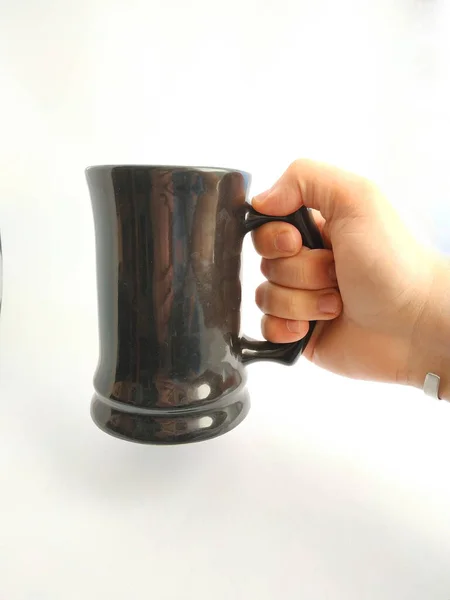 grabbing a mug of stout