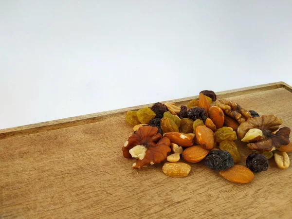 aerial view of nuts on a wood on a white background