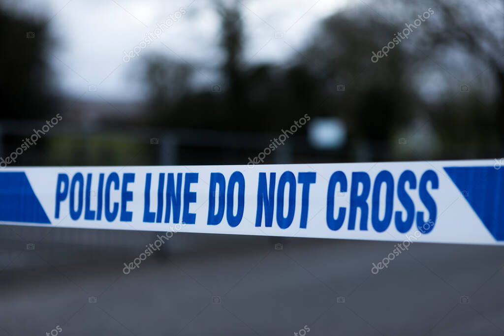 Police barrier tape in the UK at the scene of a crime