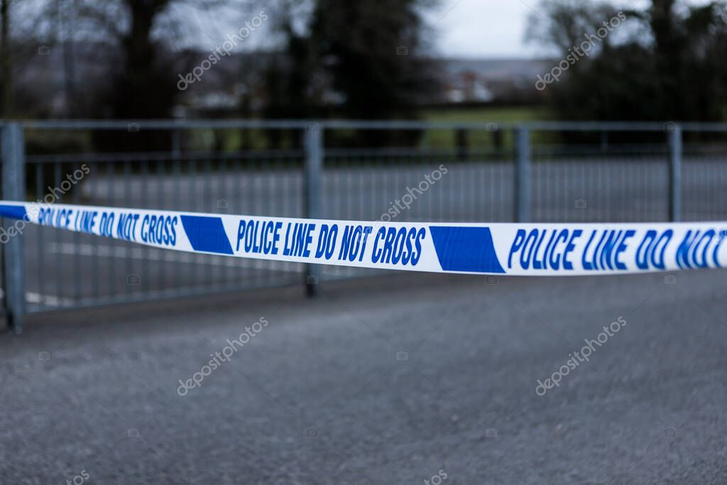 Police barrier tape in the UK at the scene of a crime