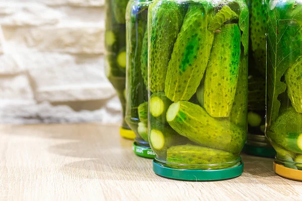 Canned pickled cucumbers in jars. Homemade food. Close-up, selective, focus