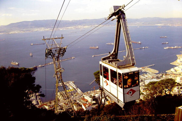 Sky tram overlooking Mediterranean Sea.
