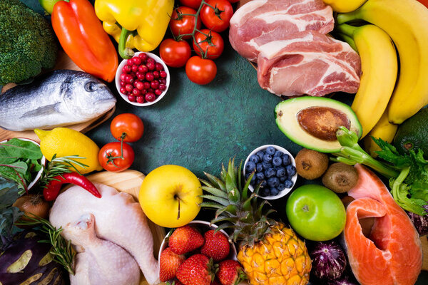 Background healthy food. Fresh fruits, vegetables, meat and fish on table. Healthy food, diet and healthy life concept. Top view, copy spac