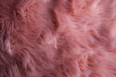 Pembe sheepskin arka plan. Kürk desen. Yün doku. Yakın u koyun kürk