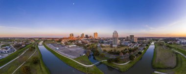 Aerial panorama picture of the Fort Worth skyline at sunset from west direction clipart