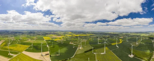 Panoramic aerial view over giant wind power field in Germany