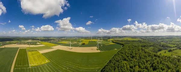 Panoramic aerial view over giant wind power field in Germany