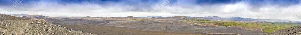 Panoramic picture over colorful Hverir geothermal area from Hverfjall volcano crater on Iceland in summer