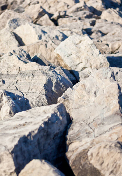 Recording of a rockbreaker made of stones on Lake Erie with high contrasts between sun and shadow