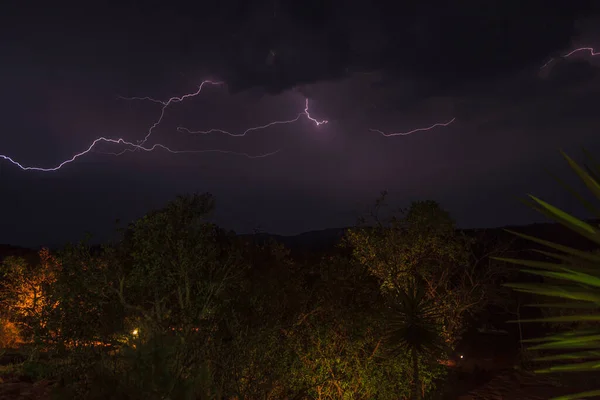 Photo of thunderstorm flashes in the night sky above Kruger National Park photographed in South Africa in September 2013
