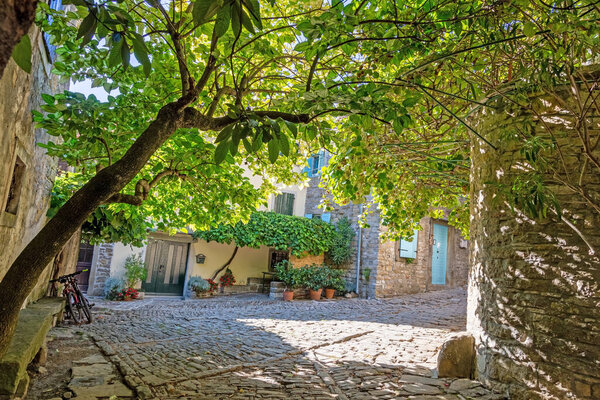 Typical street scene of the medieval town of Groznjan on the Istrian peninsula without people during daytime