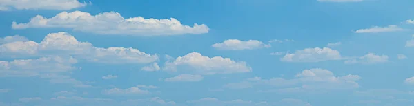 Image of a partly cloudy and partly clear sky during the day without horizon