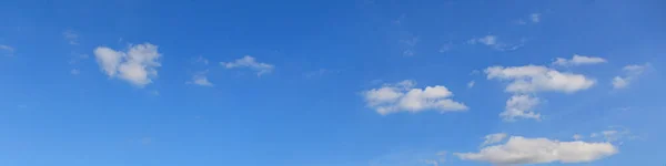 Image of a partly cloudy and partly clear sky during the day without horizon