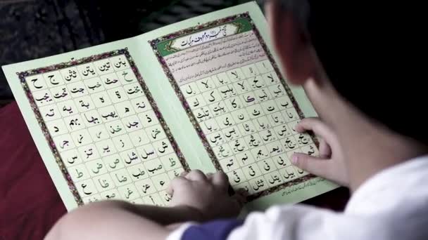 Muslim Kid Reading Islamic Book — Stock Video