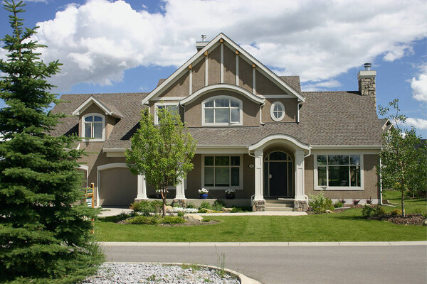 Large, single family home beautifully designed with landscaping.