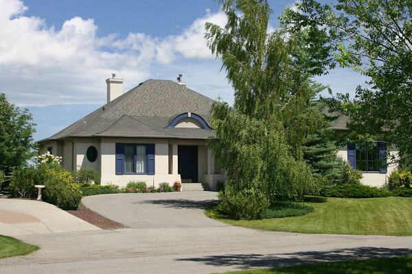 Large, single family home beautifully designed with landscaping.