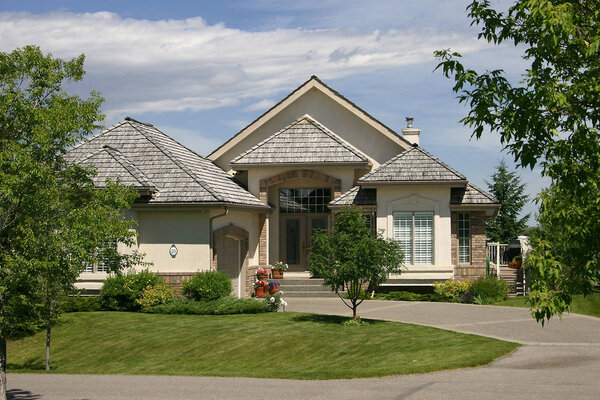 Large, single family home beautifully designed with landscaping.