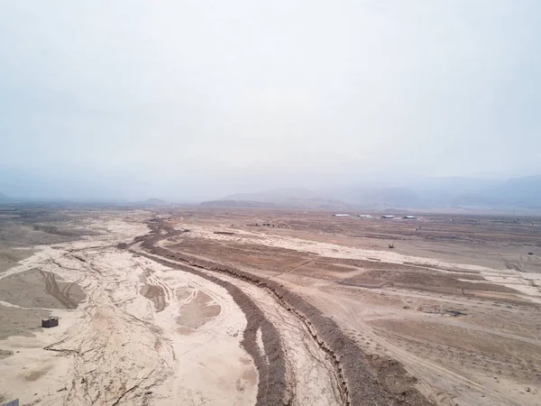 Aerial image over dry river bed in Lima Peru.