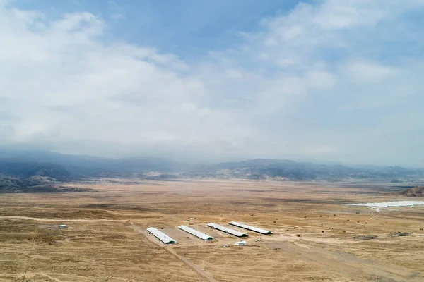 Aerial image of chicken farm in LIma peru. Desertic land.