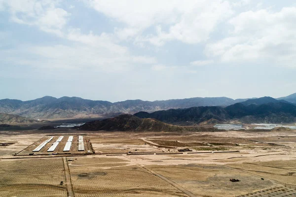 Aerial image of chicken farm in LIma peru. Desertic land.