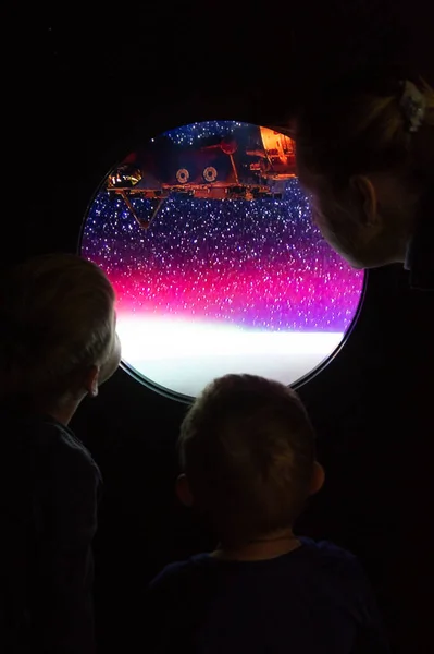 looking at the stars through the porthole