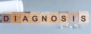 DiAGNOSIS. Tahta bloklardan harflerle yazılmış kelimeler. Endişeli ve gergin bir stres konsepti..