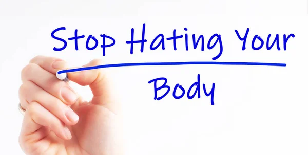 Hand writing inscription Stop Hating Your Body with blue marker, concept.