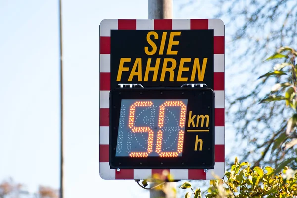 Digital speed limit sign in germany shows car driver speed measurement. (Translation \