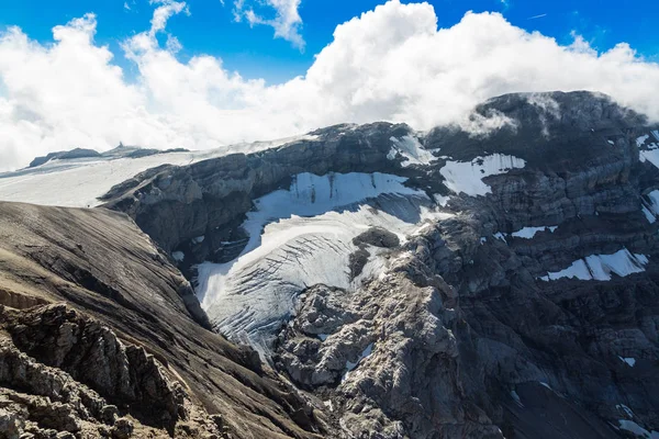 Melting glacier on the top of the mountain in swiss Alps