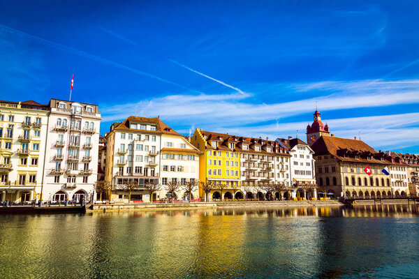Old town buildings over Reuss river in Lucerne city in Switzerland