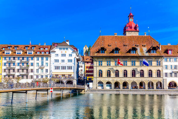 Old town buildings over Reuss river in Lucerne city inSwitzerland